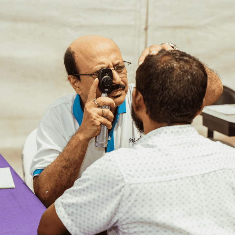 Eye doctor checking patient's vision during an eye examination